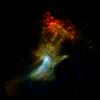 The pulsar wind nebula known as the "Hand of God." X-ray light seen by Chandra with energy ranges of 0.5 to 2 kiloelectron volts (keV) and 2 to 4 keV is shown in red and green, respectively, while X-ray light detected by NuSTAR in the higher-energy range of 7 to 25 keV is blue. (Credit: NASA/JPL-Caltech/McGill.)