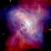 A composite image of the Crab Nebula showing the X-ray (blue), and optical (red) images superimposed. The size of the X-ray image is smaller because the higher energy X-ray emitting electrons radiate away their energy more quickly than the lower energy optically emitting electrons as they move. (Credit: Optical: NASA/HST/ASU/J. Hester et al. X-Ray: NASA/CXC/ASU/J. Hester et al.)